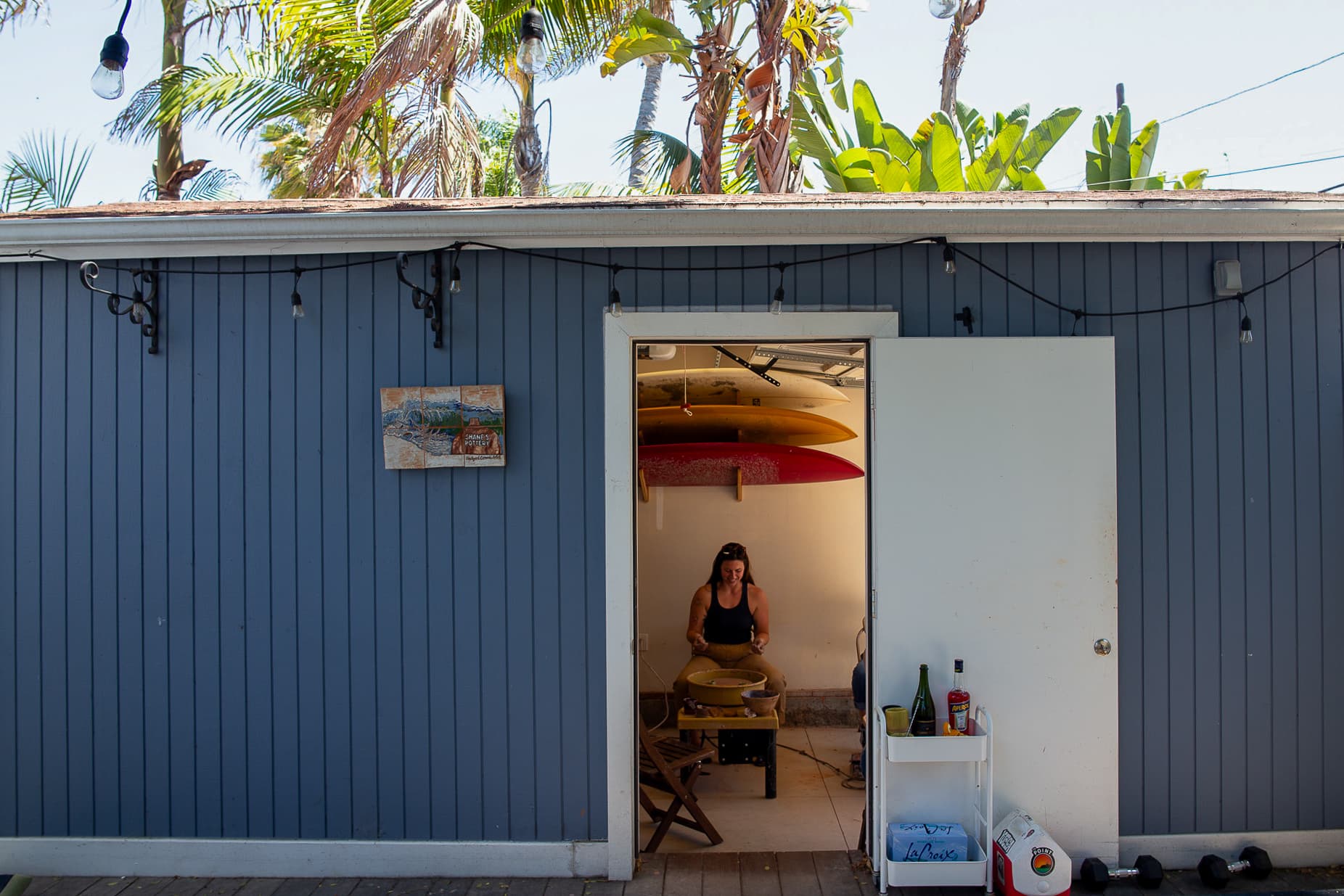 Shane's Pottery studio exterior with palm trees
