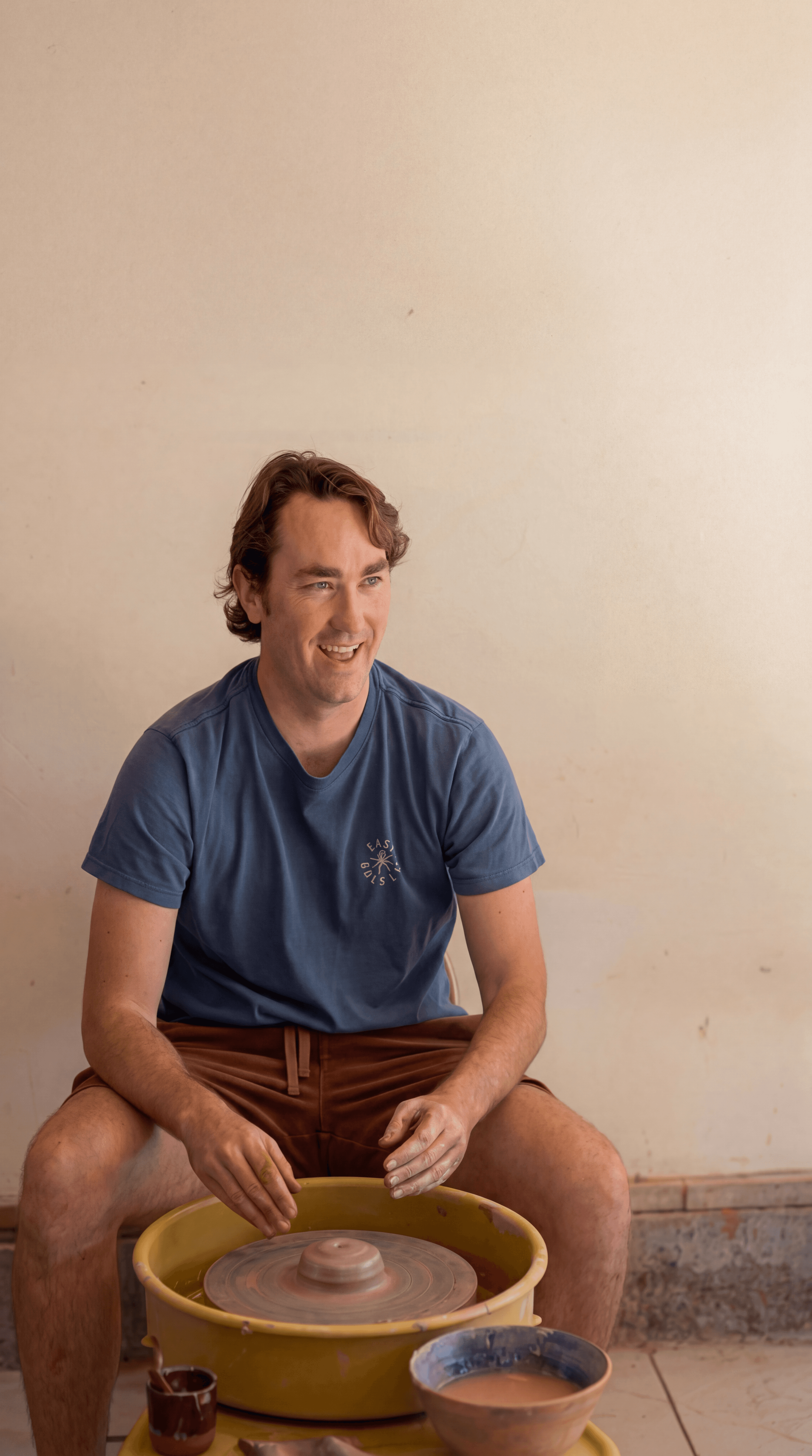 Shane Joyer at the pottery wheel in his North Park studio